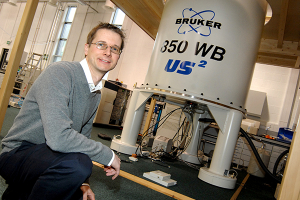 Photo of Steven Brown with NMR spectrometer