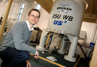 Photo of Steven Brown with NMR spectrometer