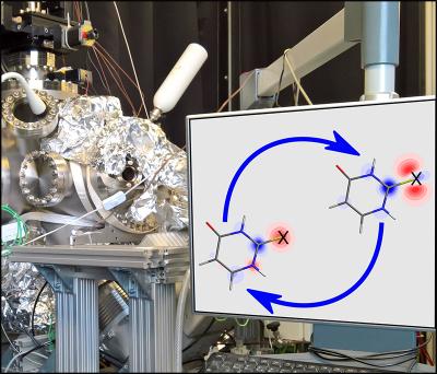 Photo of computer screen with schematic of the charge flow and the XPS instrument in the background.