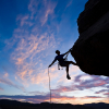 Risk: photo of a climber hanging from an overhang